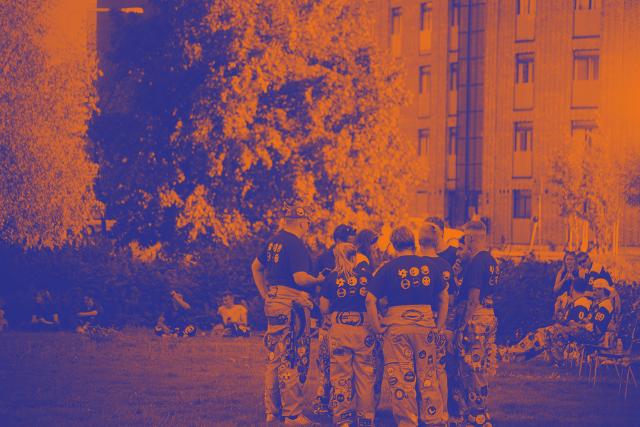 Young people sitting on the beach