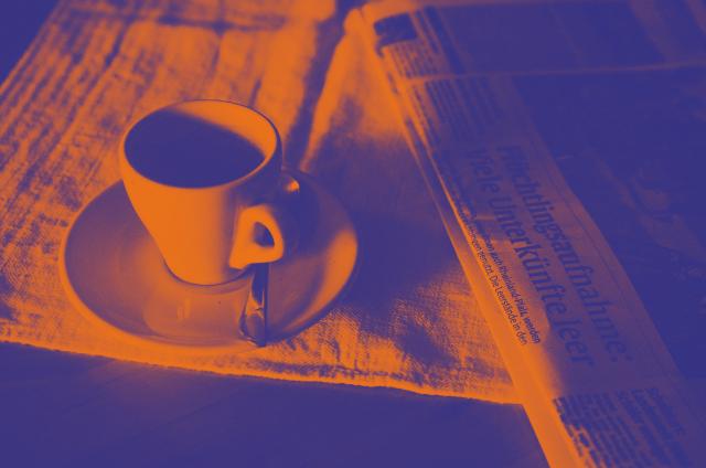 Cup on the newspaper